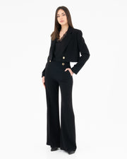 High-waisted trousers with gold buttons in enversatin