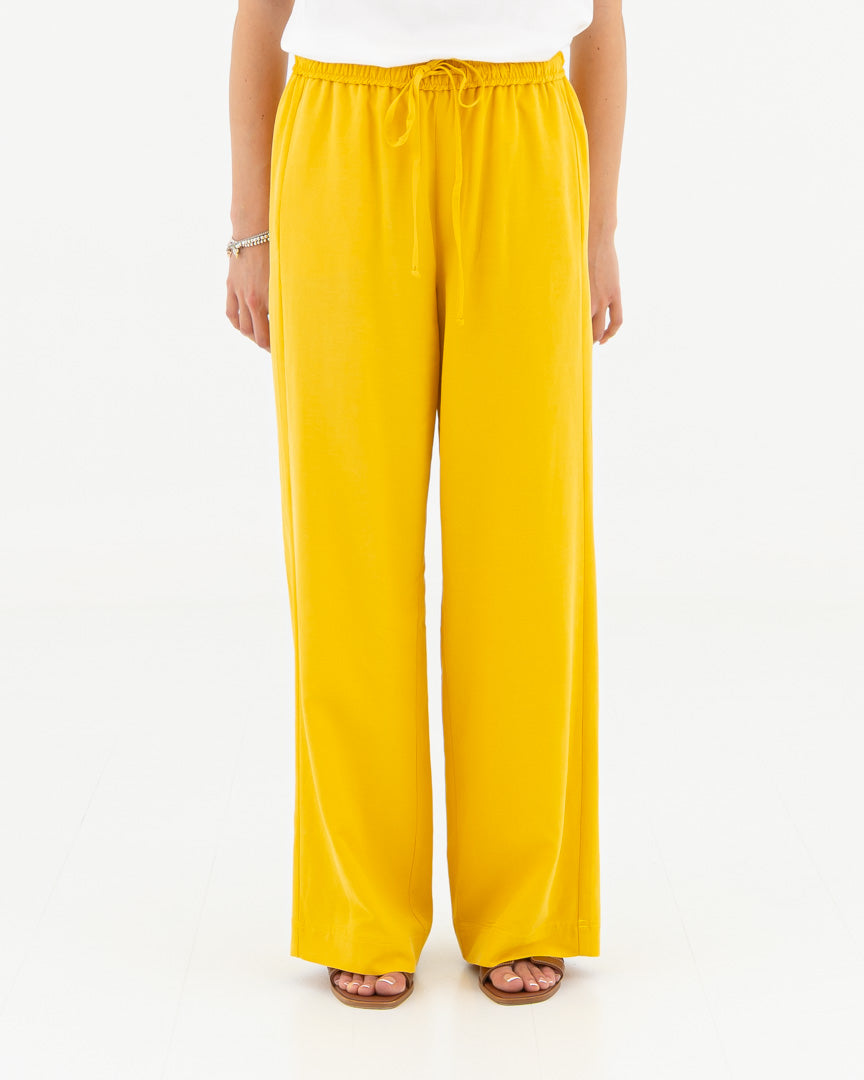 Wide trousers with elastic and adjustable laces