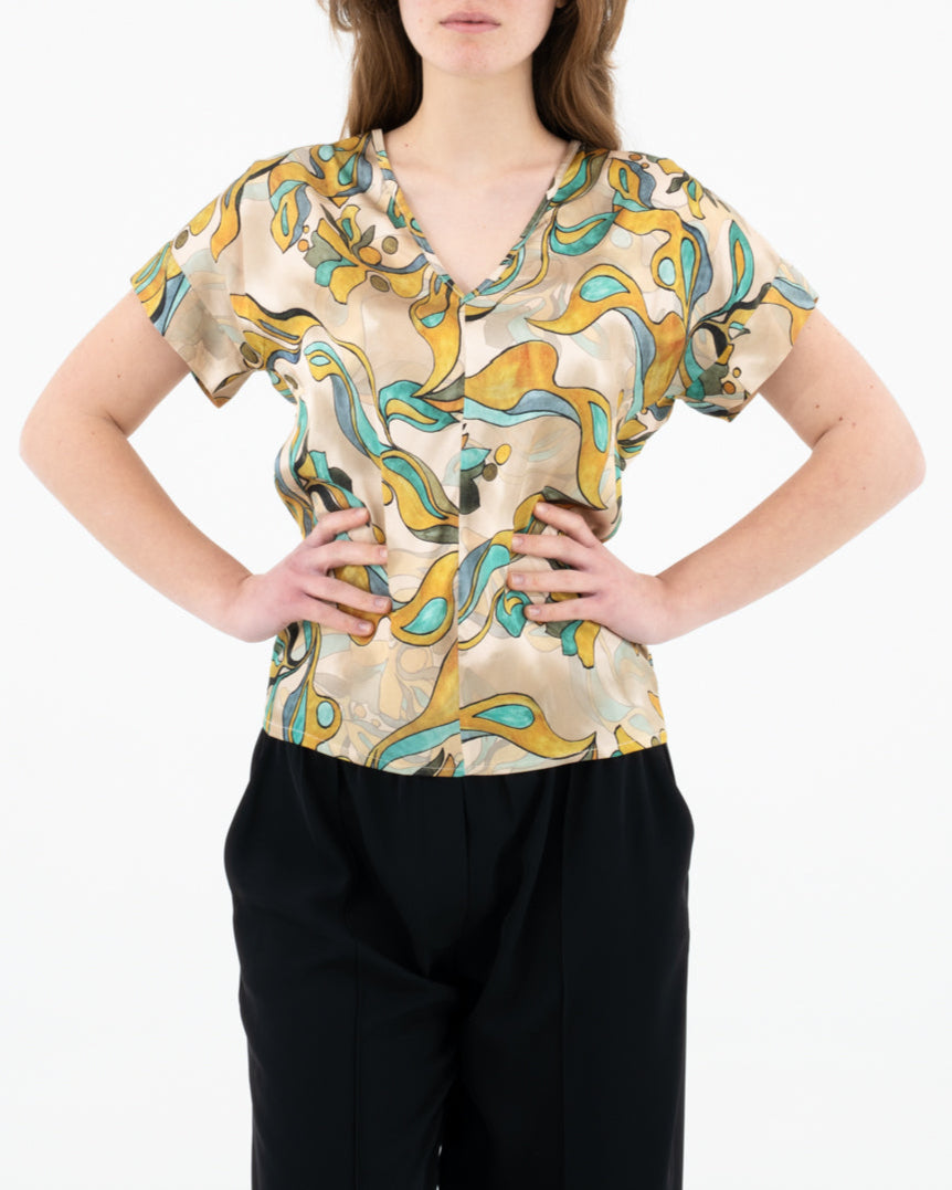 Blusa con scollo a V fantasia astratta