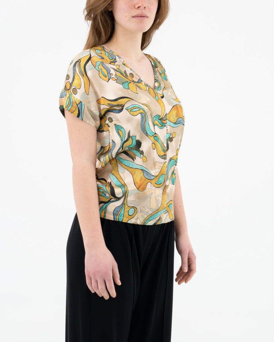 Blusa con scollo a V fantasia astratta
